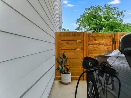 a backyard of a house with outdoor seating
