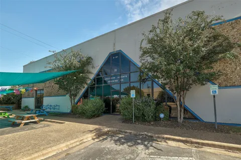 a view of a building with sitting area