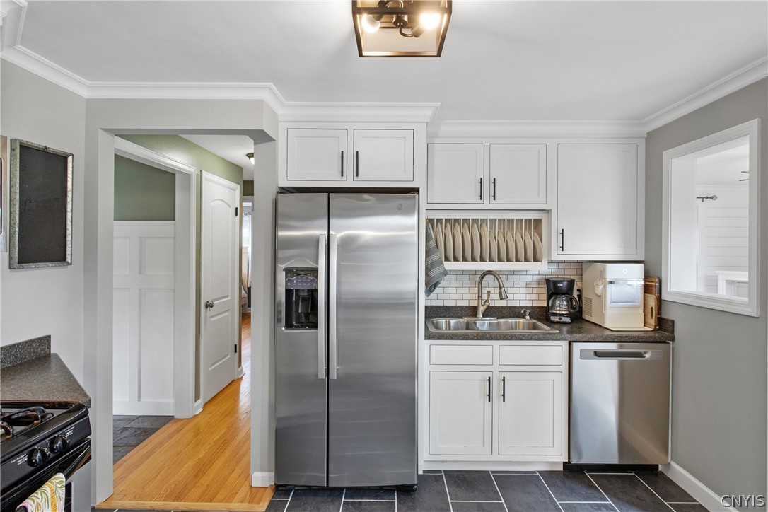 132 East Manchester Road Geddes, NY 13219 - Photo 15 of 44 The plate rack above the stainless sink is an ador