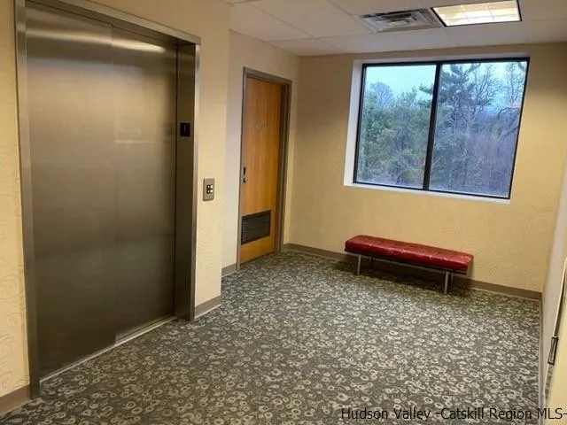 a front view of a building with parking