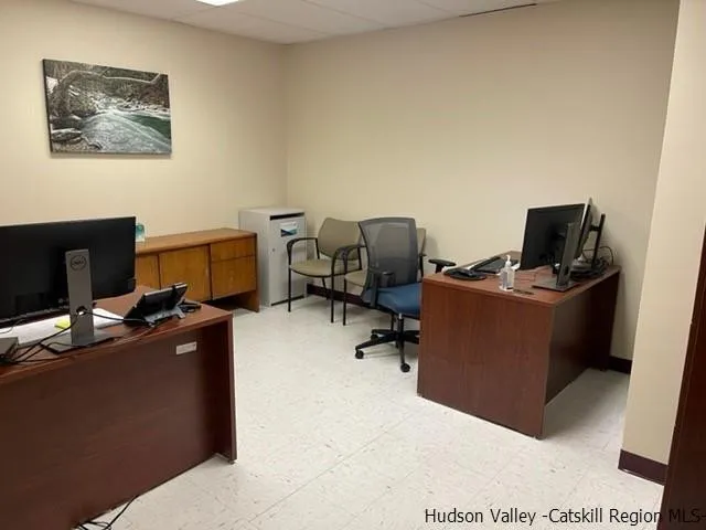 a view of a workspace with furniture