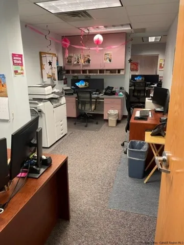a kitchen with kitchen island a stove a refrigerator and a sink