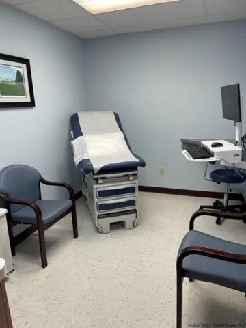 a bedroom with a workspace