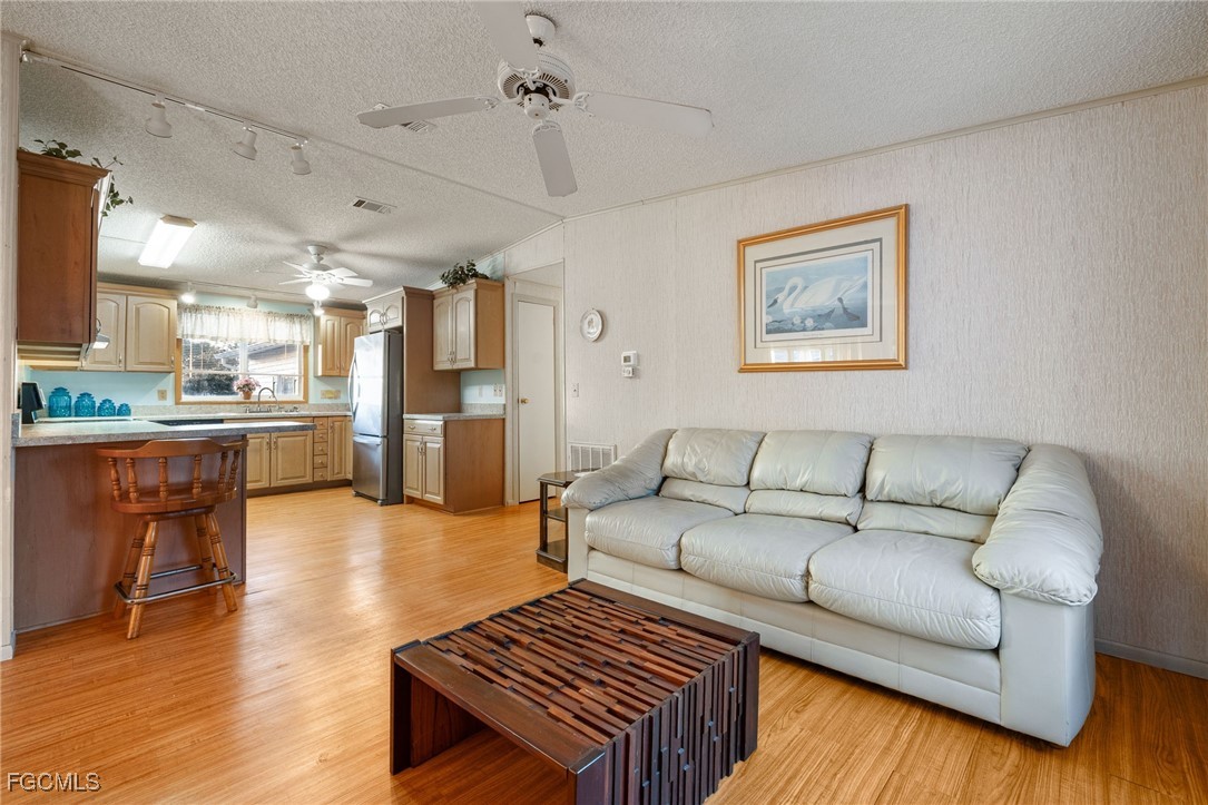 19658 Eagle Trace Court North Fort Myers, FL 33903 - Photo 11 of 40 a living room with furniture and kitchen view