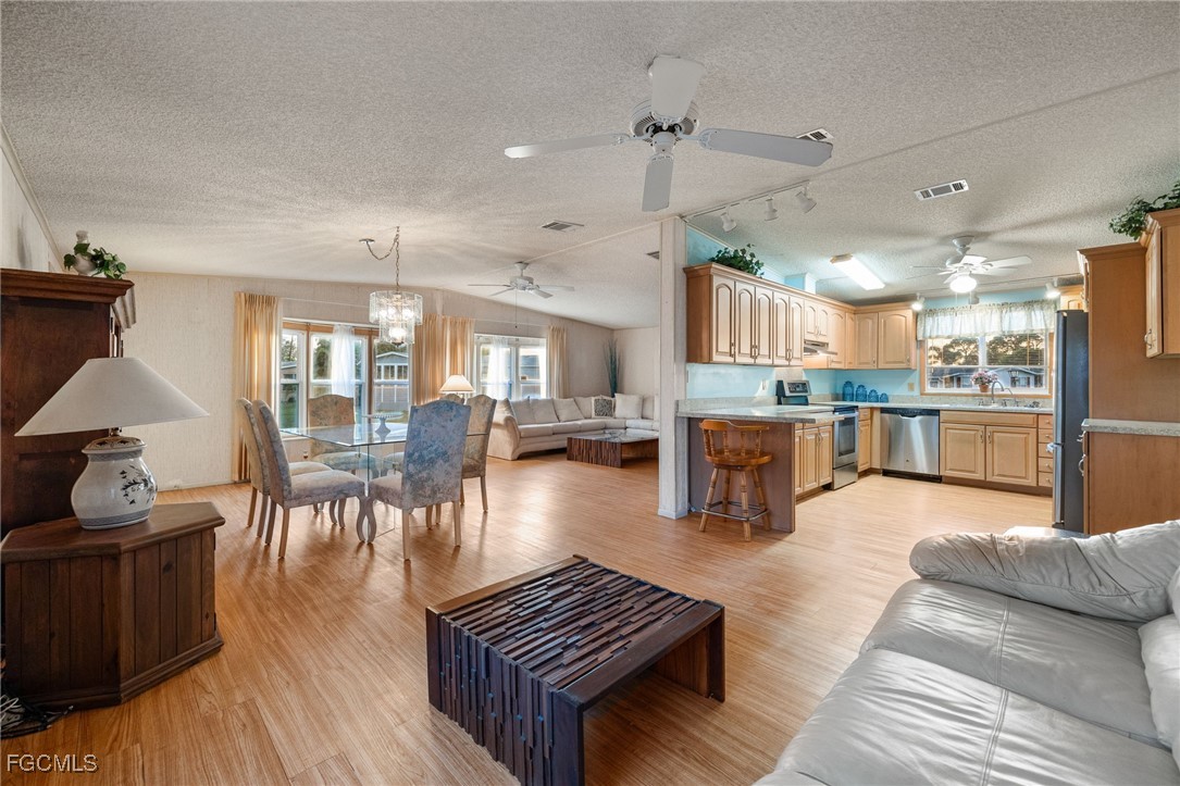 19658 Eagle Trace Court North Fort Myers, FL 33903 - Photo 12 of 40 a living room with furniture and kitchen view