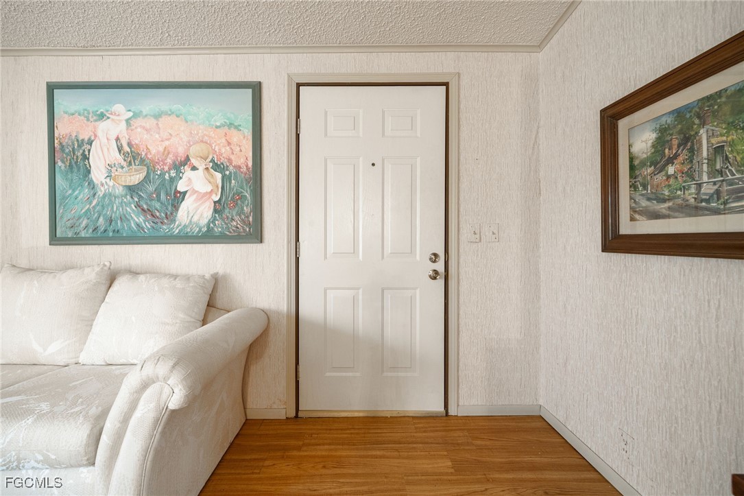 19658 Eagle Trace Court North Fort Myers, FL 33903 - Photo 3 of 40 a view of a bedroom with furniture and wooden floor