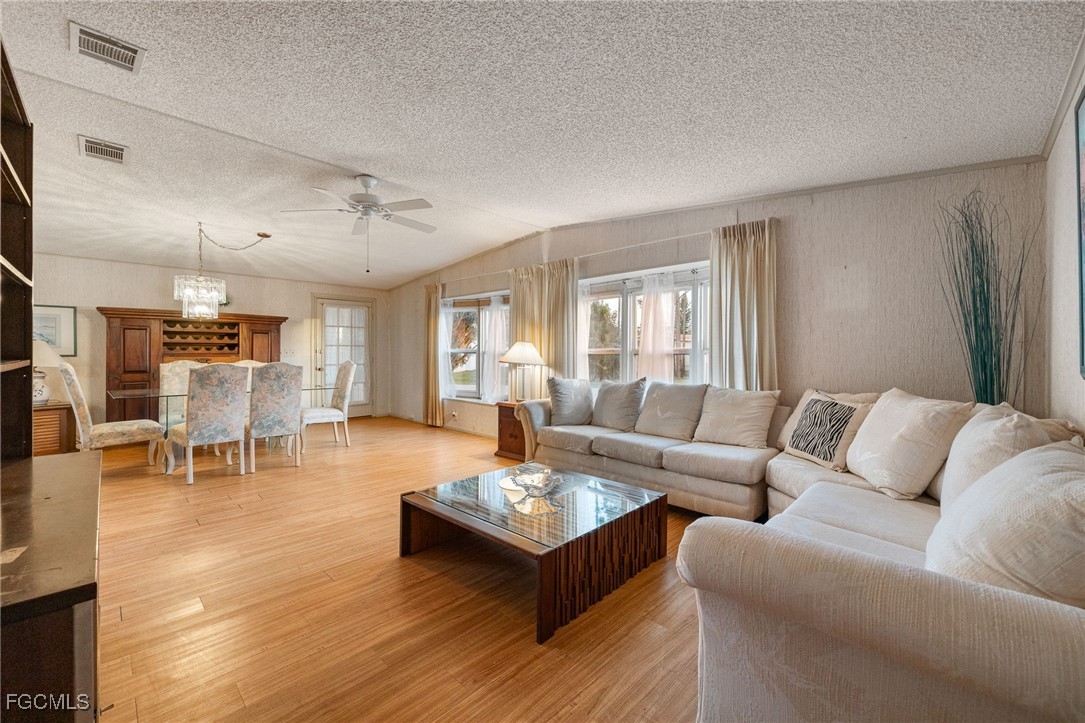 19658 Eagle Trace Court North Fort Myers, FL 33903 - Photo 4 of 40 a living room with furniture and wooden floor