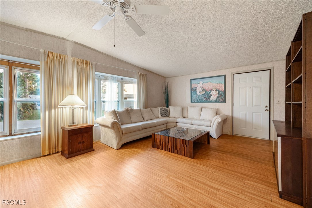 19658 Eagle Trace Court North Fort Myers, FL 33903 - Photo 6 of 40 a living room with furniture and a large window