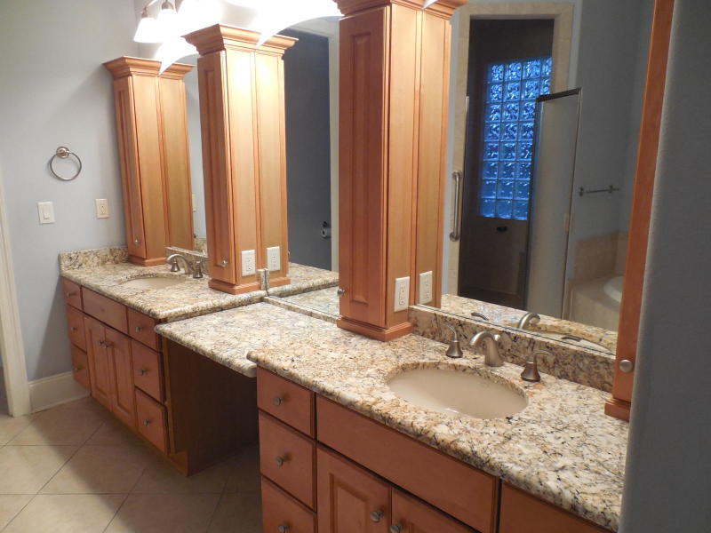 4498 Stonebridge Road Destin, FL 32541 - Photo 4 of 6 a bathroom with a granite countertop sink and a mirror