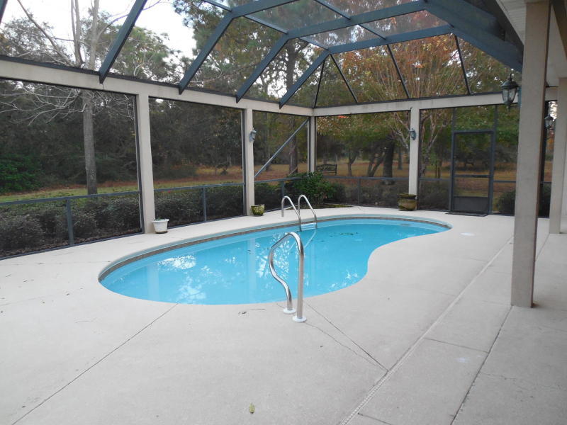 4498 Stonebridge Road Destin, FL 32541 - Photo 6 of 6 a view of a swimming pool with a couches in patio