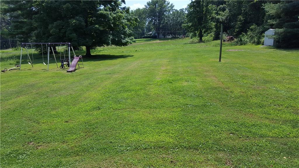 284 Ferncliff Road Rices Landing, PA 15357 - Photo 17 of 17 Flat back yard with children's play area. Swing set is included with the sale.