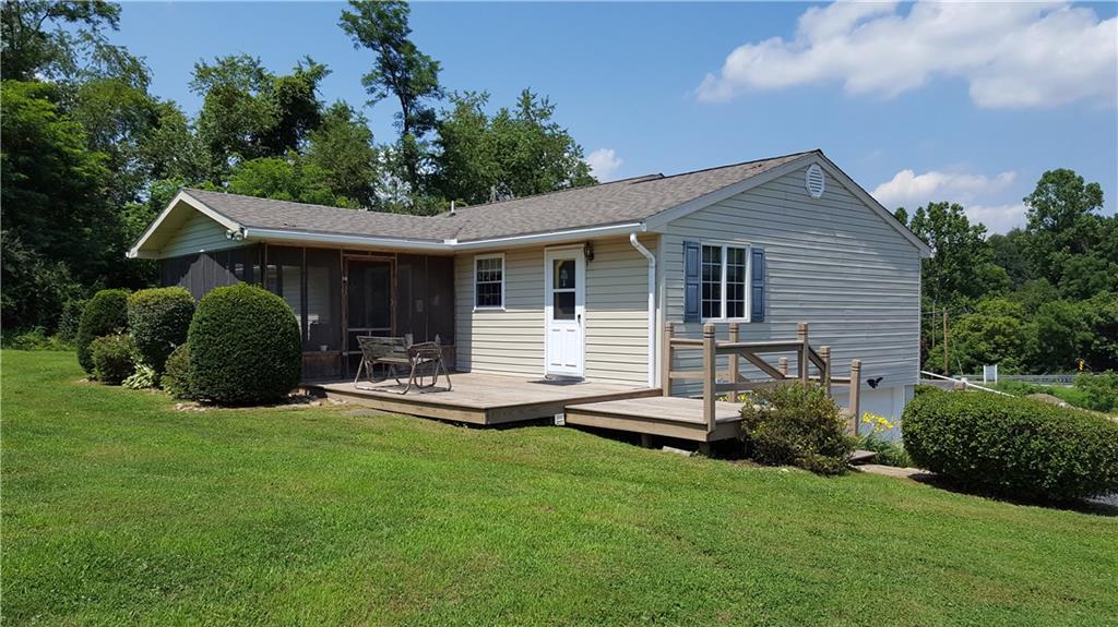 284 Ferncliff Road Rices Landing, PA 15357 - Photo 4 of 17 The back of the home features a deck and enclosed porch. Plenty of space for family meals and gatherings.