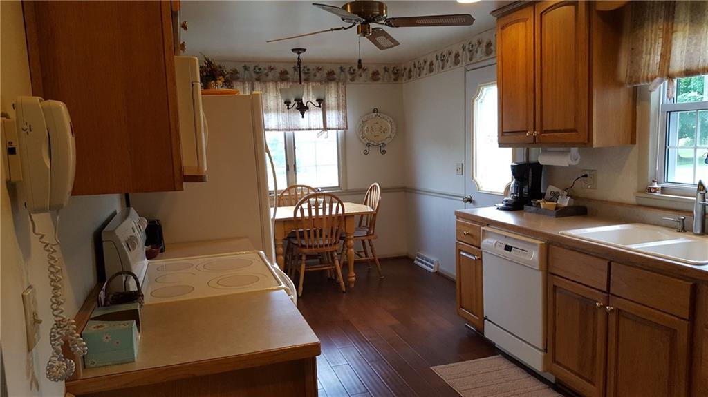 284 Ferncliff Road Rices Landing, PA 15357 - Photo 6 of 17 Yes,we do have an eat in kitchen also. Notice the flooring upgrade and ceiling fan. Perfect!