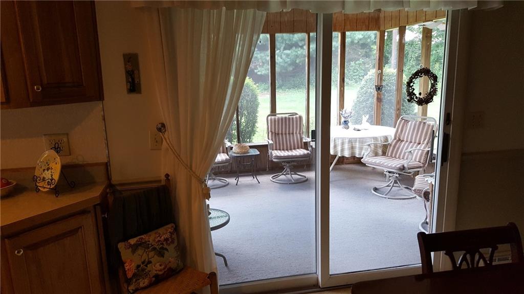 284 Ferncliff Road Rices Landing, PA 15357 - Photo 8 of 17 Thru the sliding glass doors is the screened in porch. Can you imagine your evenings out there reading your favorite book or enjoying your favorite beverage?