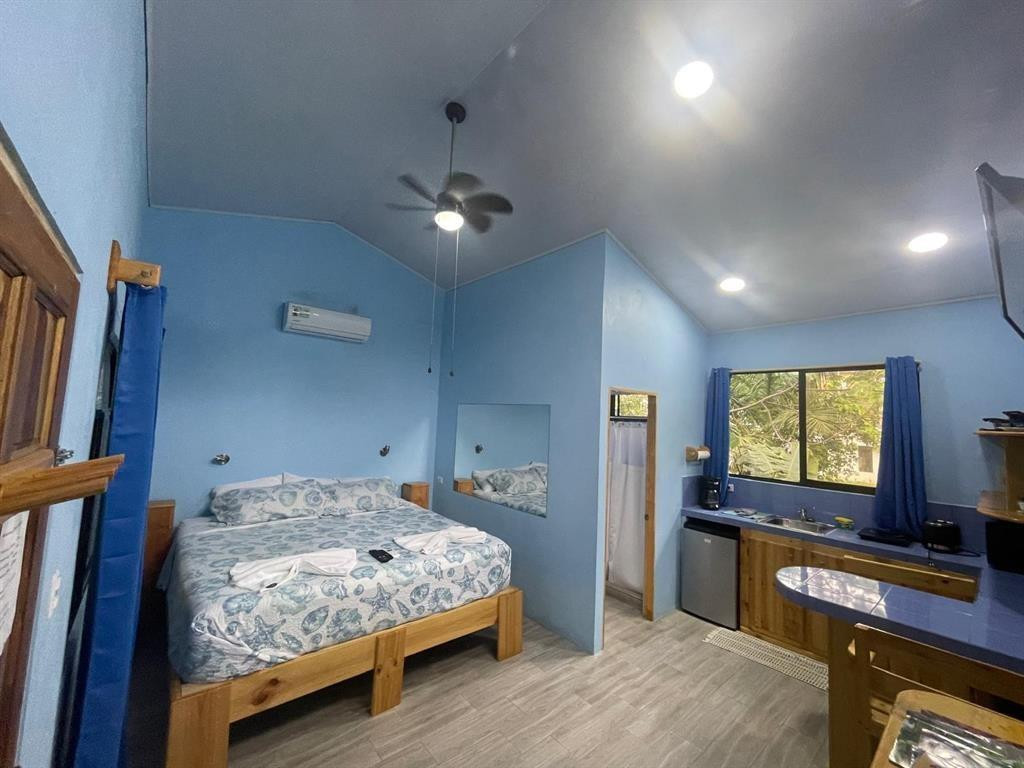 Undisclosed Address undefined, undefined 00000 - Photo 22 of 35 a bedroom with a bed and a flat screen tv