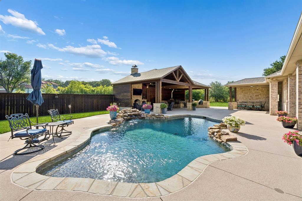 1135 Copper Canyon Road Copper Canyon, TX 76226 - Photo 9 of 40 Resort-Style Saltwater Pool With Stone Waterfall
