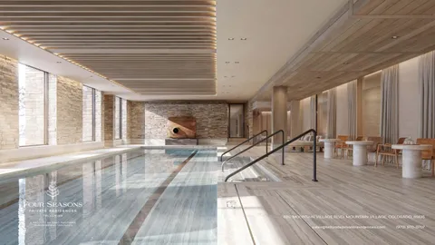 a view of staircase with a rug and a large window