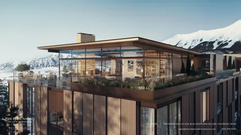 a front view of a house with wooden fence