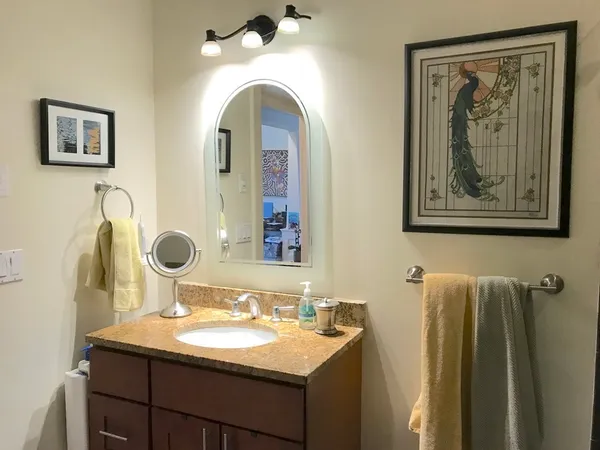 a bathroom with a sink and mirror
