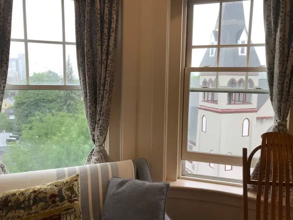 a view of a porch with furniture and front door