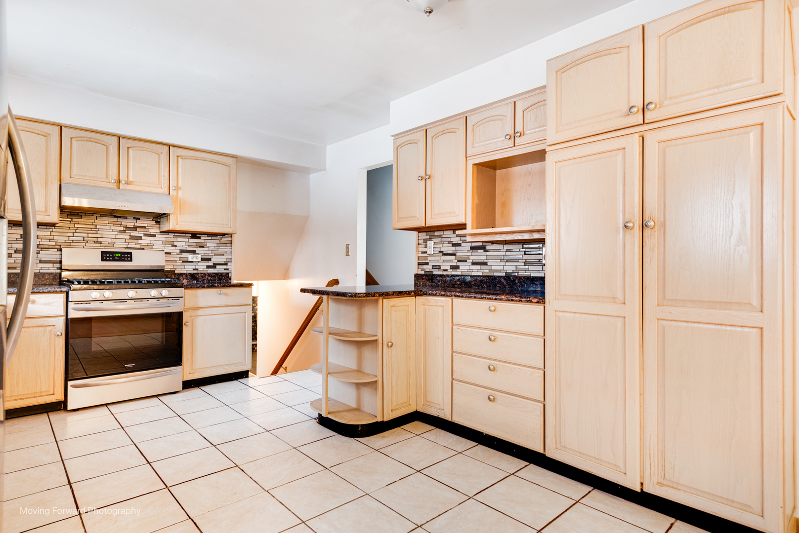 539 West Eggerding Drive Addison, IL 60101 - Photo 6 of 29 a kitchen with white cabinets and white appliances