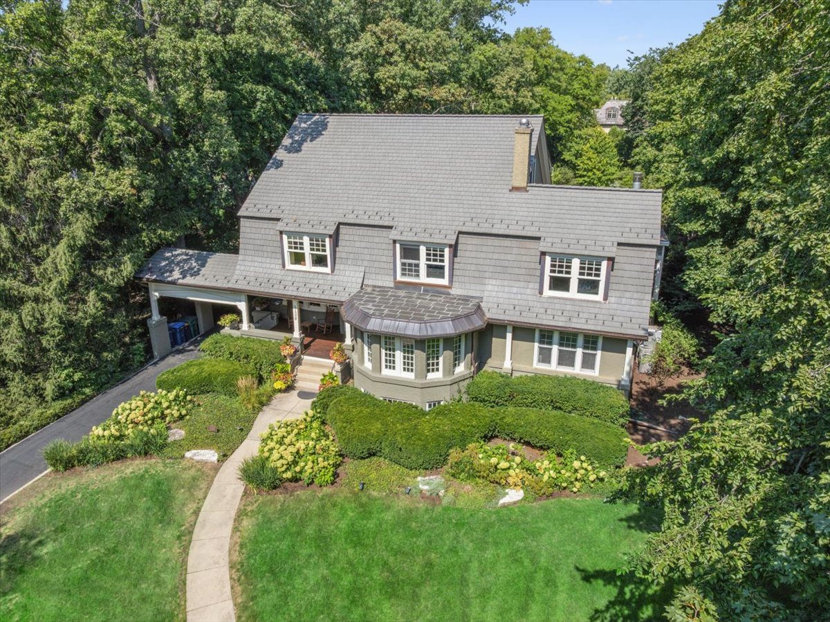 a aerial view of a house with a yard