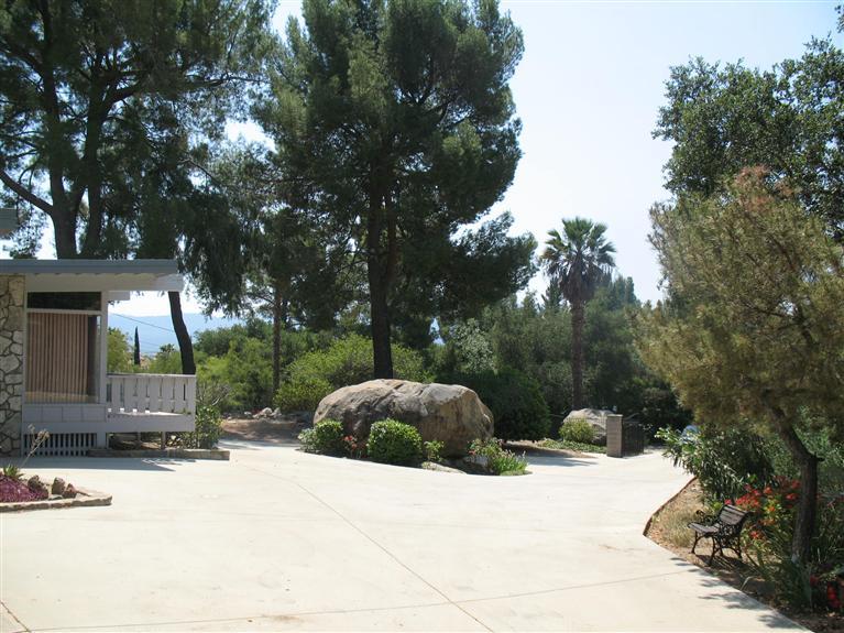 2510 Ladera Road Ojai, CA 93023 - Photo 10 of 15 a wooden bench sitting in front of a house