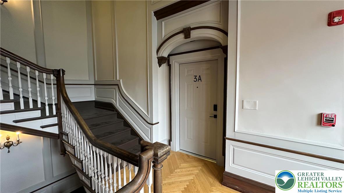 214 Spring Garden Street, Unit 3A Easton, PA 18042 - Photo 3 of 20 a view of staircase with railing and a potted plant