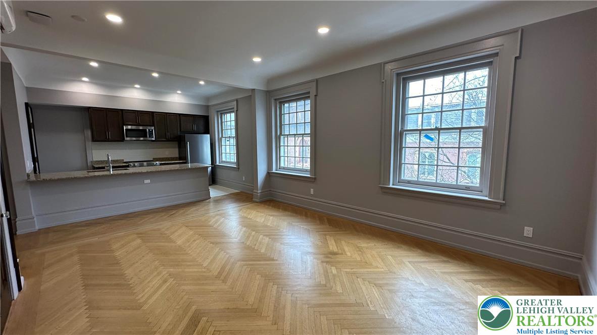 214 Spring Garden Street, Unit 3A Easton, PA 18042 - Photo 6 of 20 a view of kitchen with microwave and window