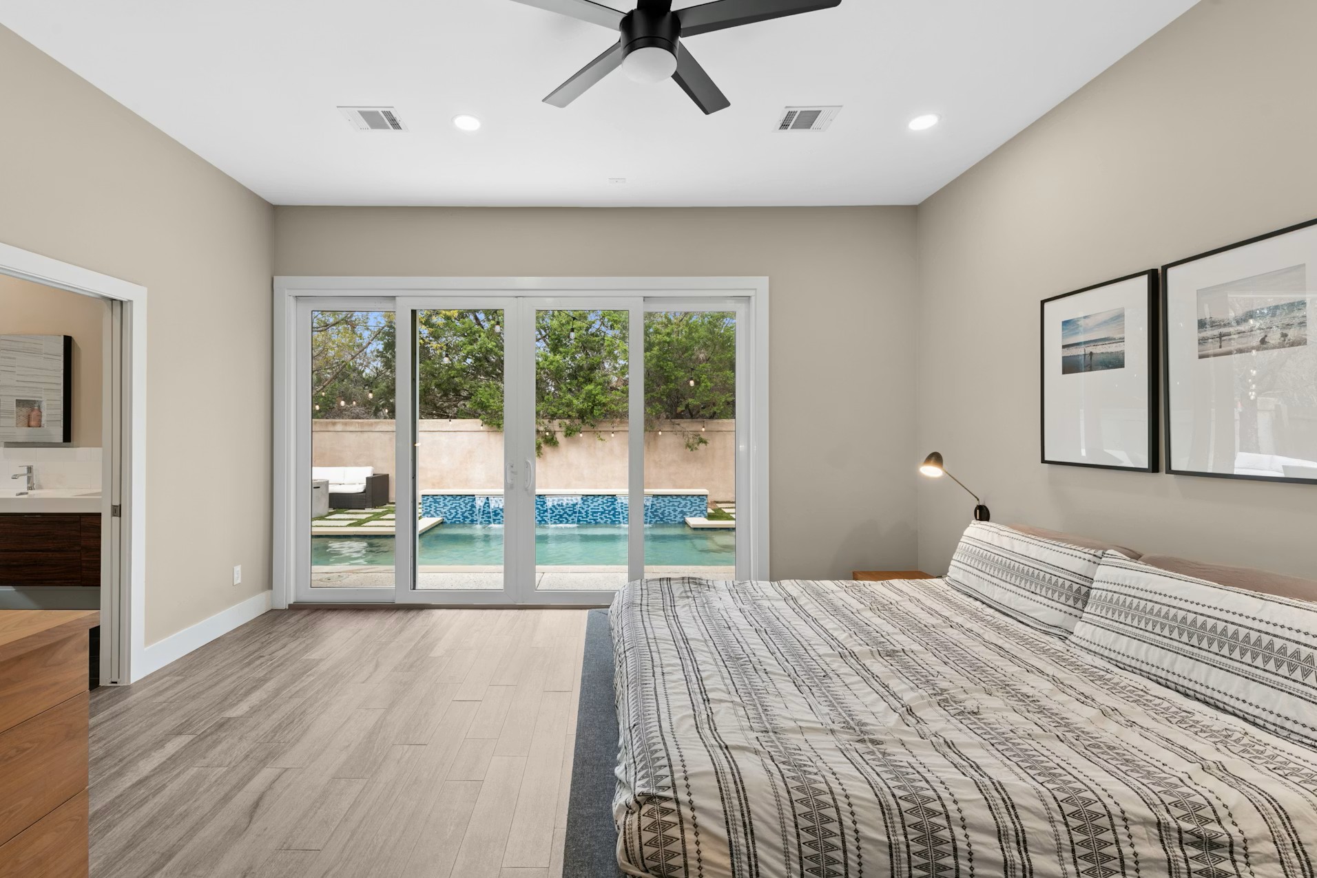 320 El Socorro Lane Austin, TX 78732 - Photo 19 of 40 a bedroom with a bed and a large window