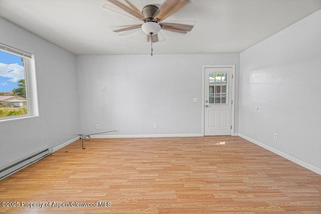 627 Lake Street Rangely, CO 81648 - Photo 13 of 44 a view of an empty room with a window