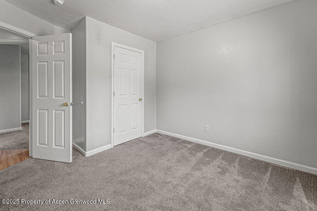 627 Lake Street Rangely, CO 81648 - Photo 20 of 44 an empty room with windows