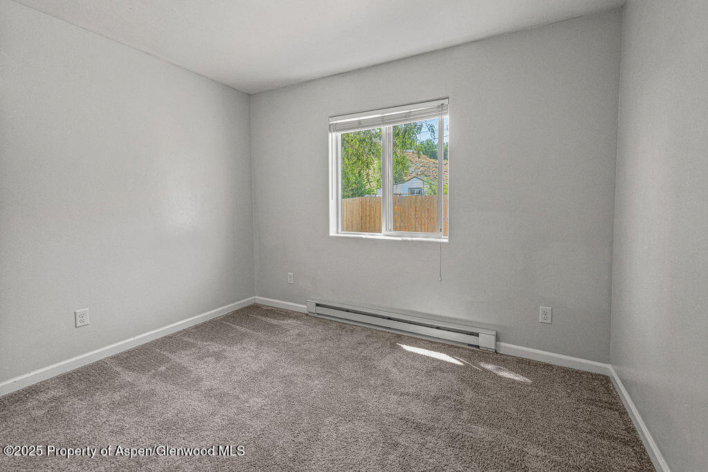 627 Lake Street Rangely, CO 81648 - Photo 21 of 44 an empty room with a window