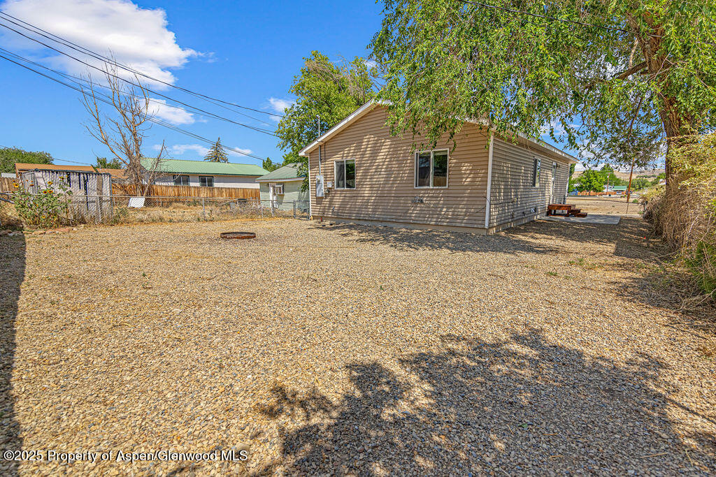 627 Lake Street Rangely, CO 81648 - Photo 3 of 44 a view of a house with a yard
