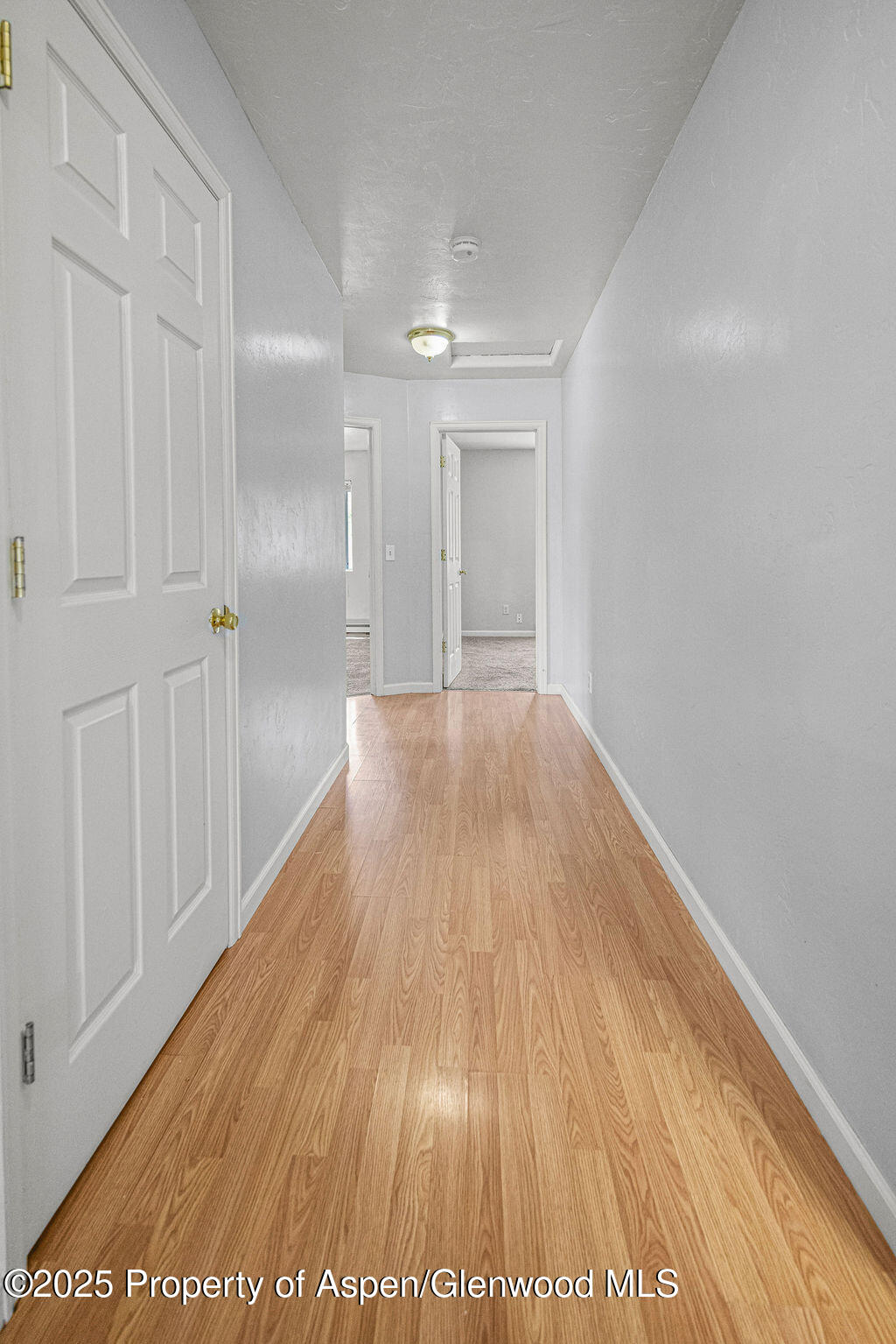 627 Lake Street Rangely, CO 81648 - Photo 31 of 44 a view of hallway with wooden floor