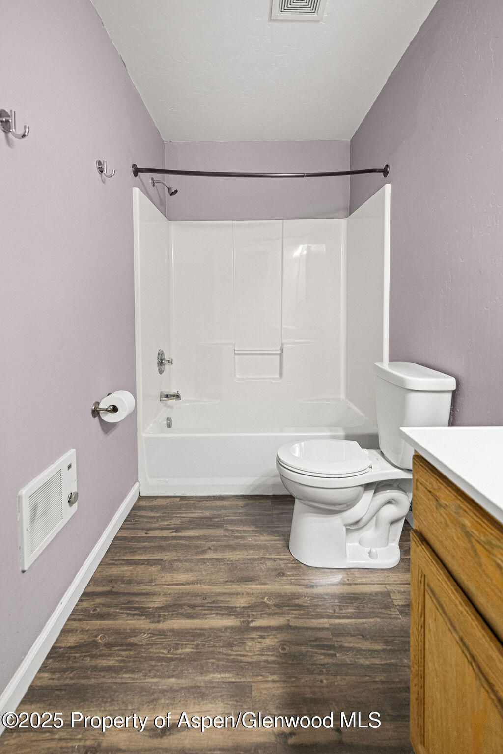 627 Lake Street Rangely, CO 81648 - Photo 32 of 44 a bathroom with a toilet a sink and shower