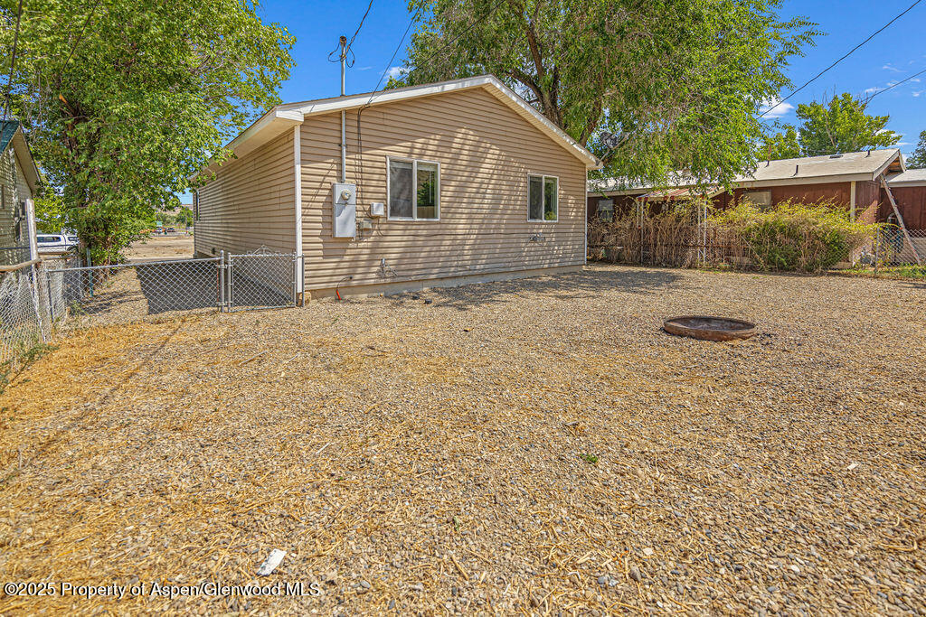627 Lake Street Rangely, CO 81648 - Photo 38 of 44 a front view of a house with yard