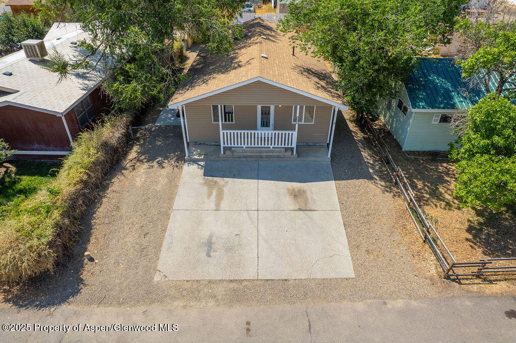 627 Lake Street Rangely, CO 81648 - Photo 40 of 44 a front view of a house with a yard