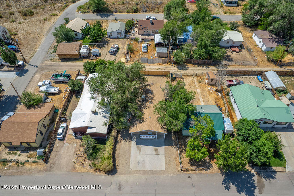 627 Lake Street Rangely, CO 81648 - Photo 43 of 44 an aerial view of a house with a yard and lake view