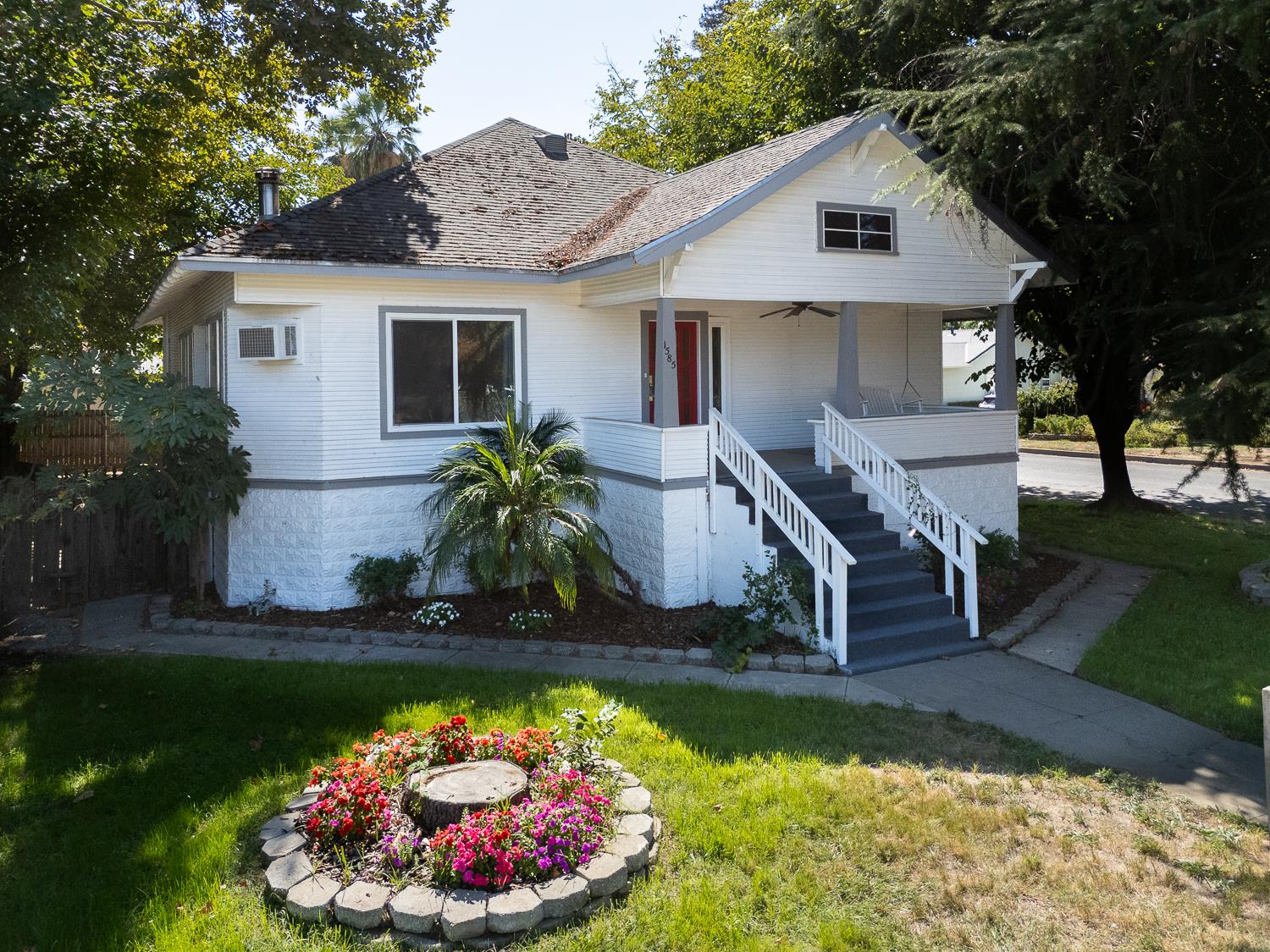 1585 Sycamore Street Gridley, CA 95948 - Photo 1 of 69 a front view of a house with a yard and garage