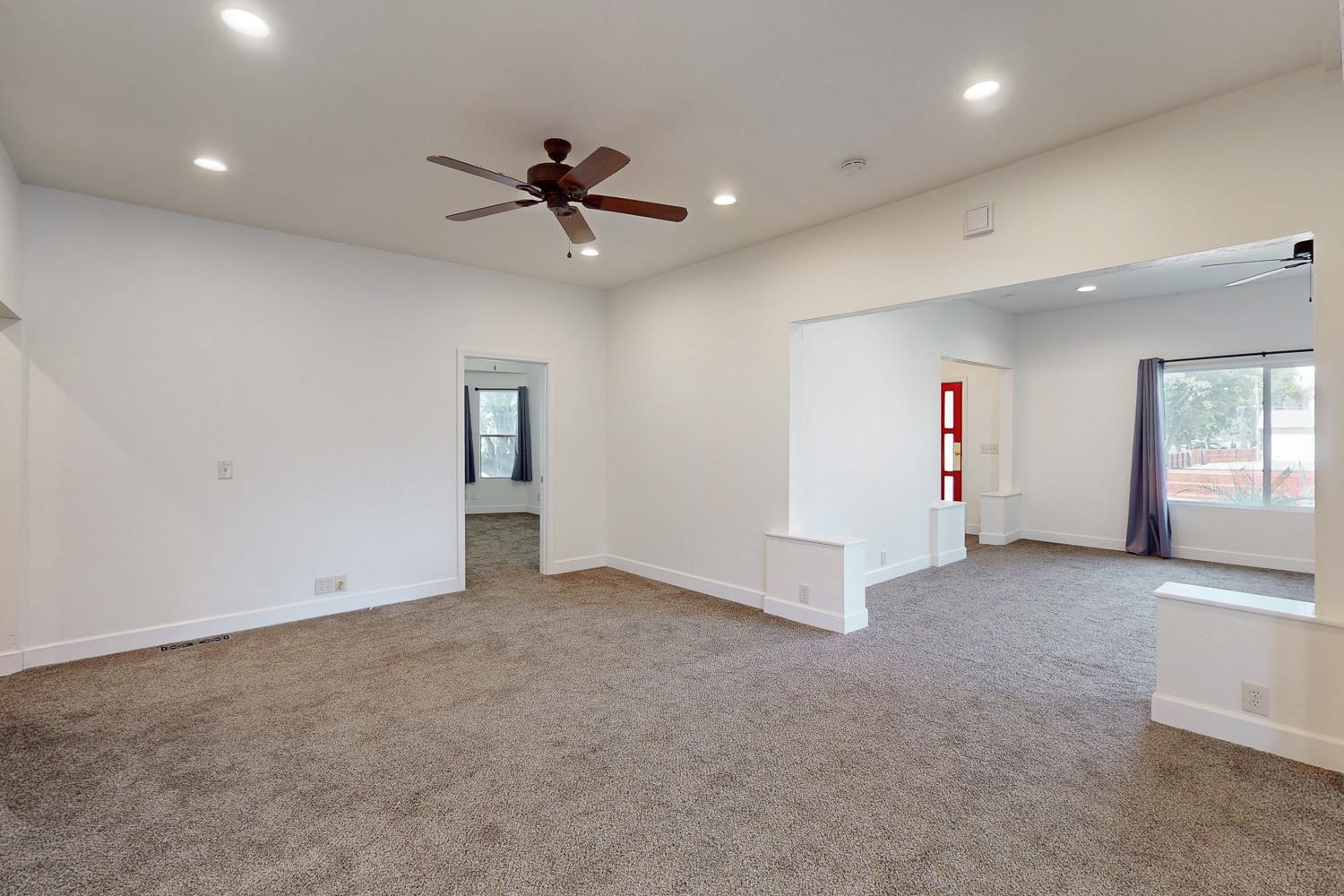 1585 Sycamore Street Gridley, CA 95948 - Photo 15 of 69 an empty room with windows and ceiling fan