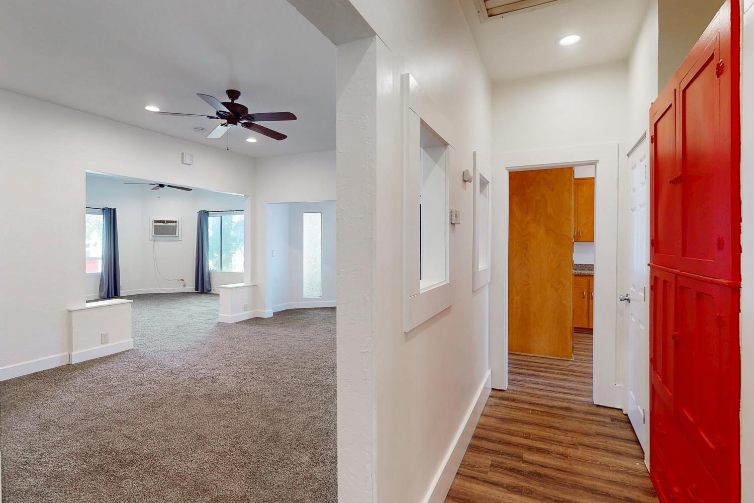 1585 Sycamore Street Gridley, CA 95948 - Photo 4 of 69 a view of a hallway with wooden floor and staircase