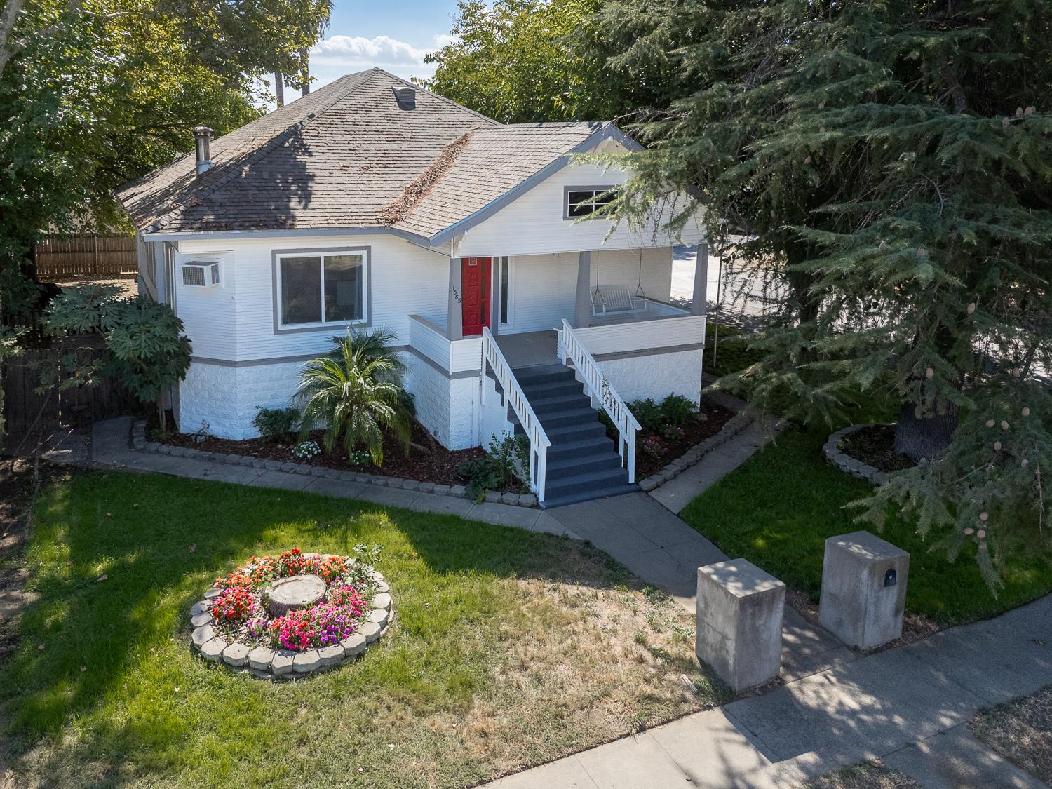 1585 Sycamore Street Gridley, CA 95948 - Photo 42 of 69 a front view of a house with a yard fountain