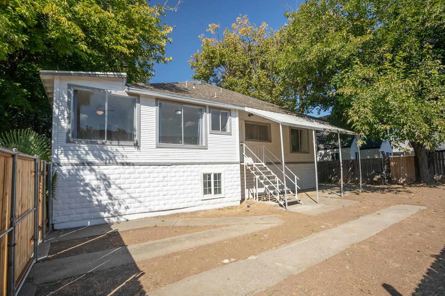 1585 Sycamore Street Gridley, CA 95948 - Photo 66 of 69 a front view of a house with a yard