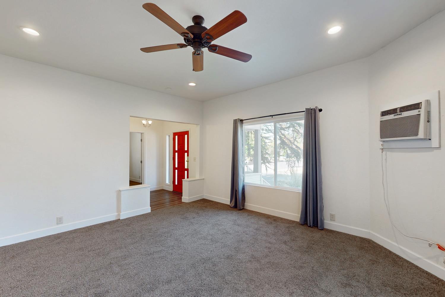 1585 Sycamore Street Gridley, CA 95948 - Photo 8 of 69 an empty room with chandelier fan and windows