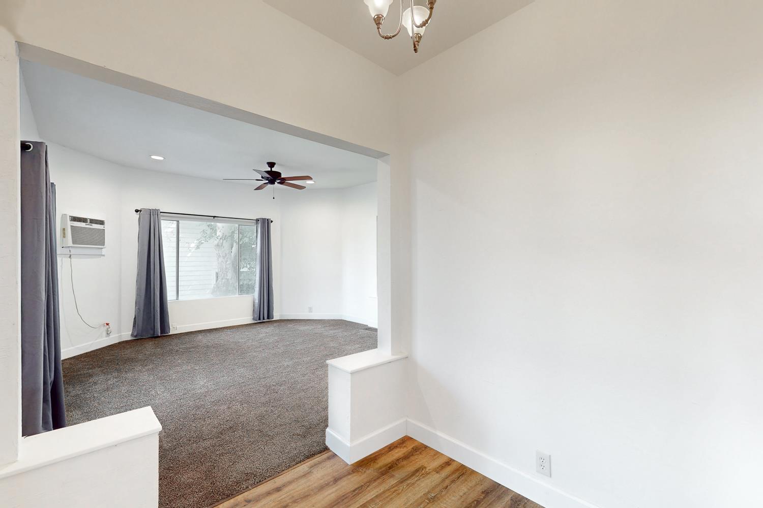 1585 Sycamore Street Gridley, CA 95948 - Photo 10 of 69 a view of a livingroom with wooden floor and a ceiling fan