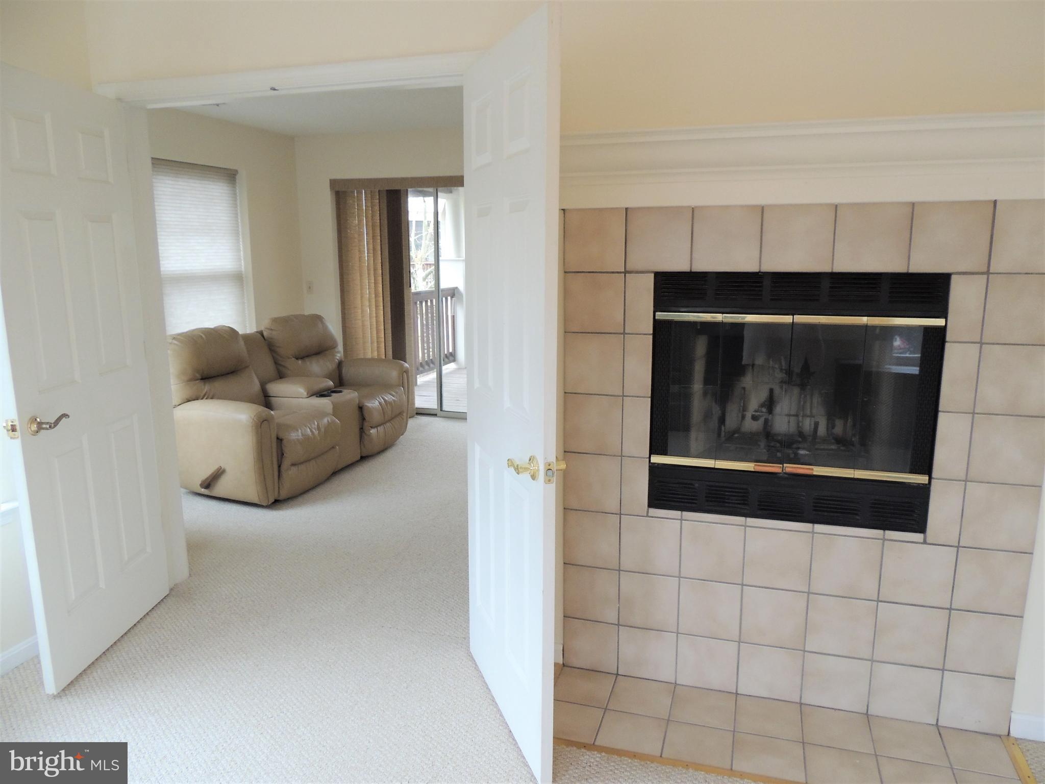 136 Square Rigger Way Solomons, MD 20688 - Photo 18 of 36 Owners suite with fireplace opens to sitting area