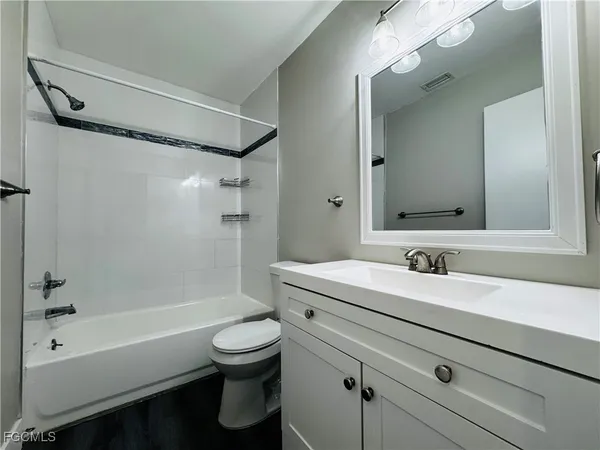 a bathroom with a sink a toilet and a bathtub