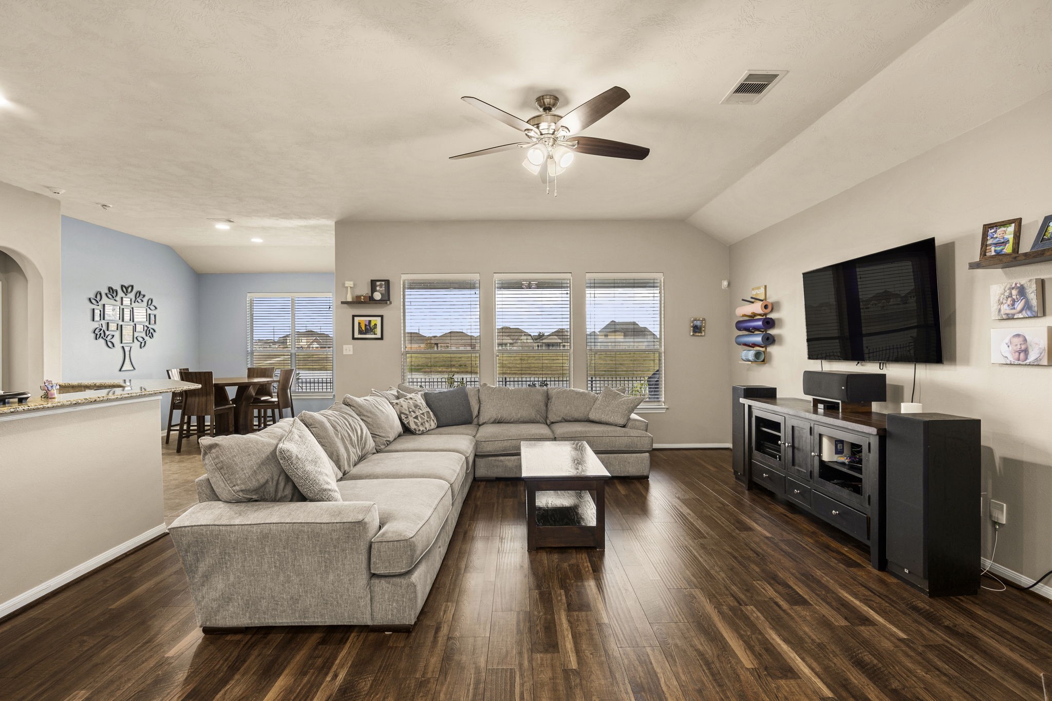 2202 Winchester Lake Rosenberg, TX 77471 - Photo 12 of 31 Home is warm and comforting, the rich engineered wood floors look great. Again lots of windows overlooking the backyard, covered patio and water. NO REAR NEIGHBORS!!!