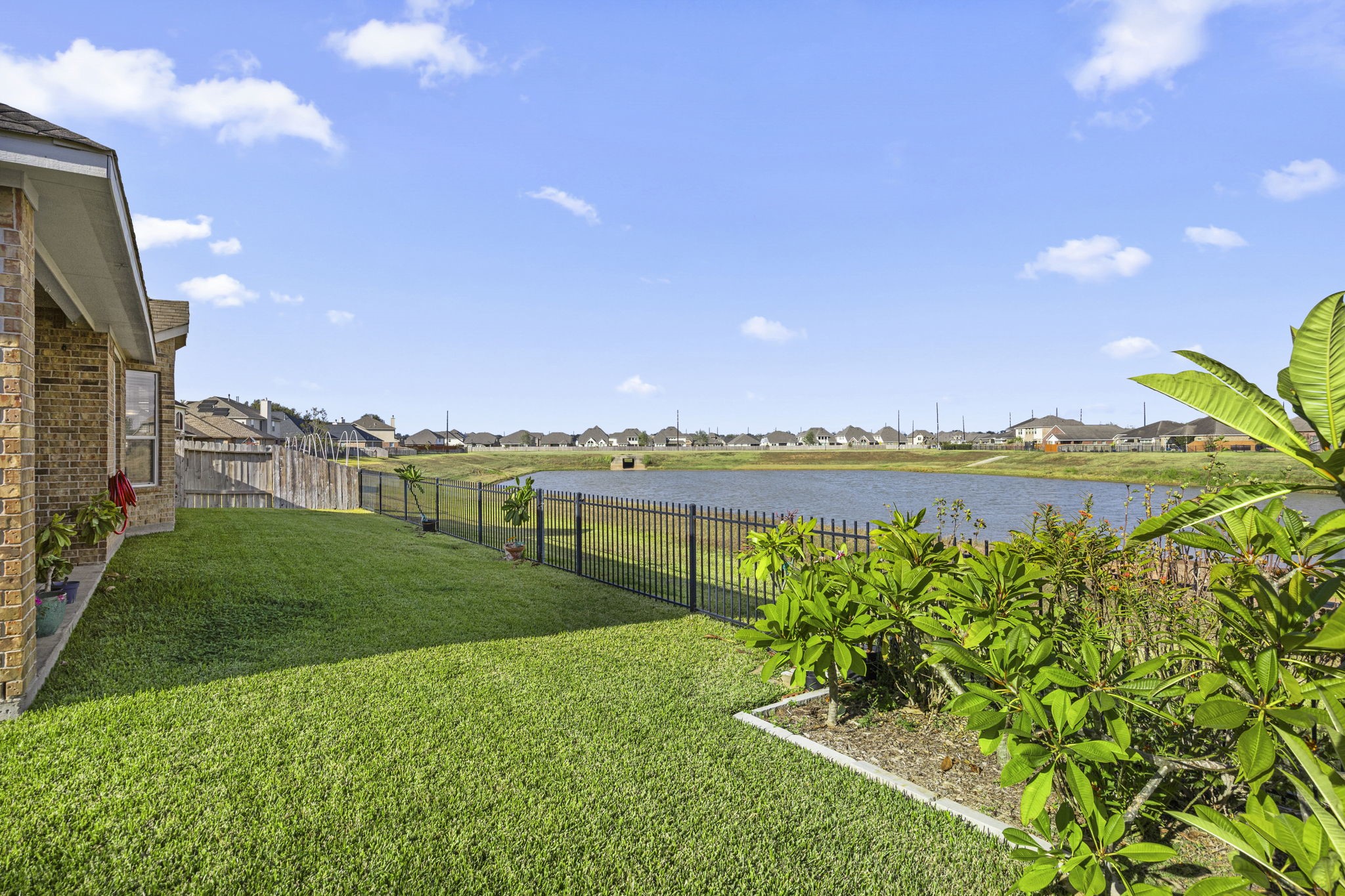 2202 Winchester Lake Rosenberg, TX 77471 - Photo 30 of 31 Backyard has room for your garden and very nice views. Enjoy a covered back patio to begin or end the day.